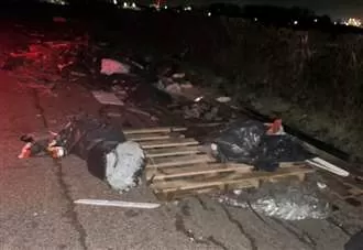Investigation after large pile of rubbish dumped in country lane