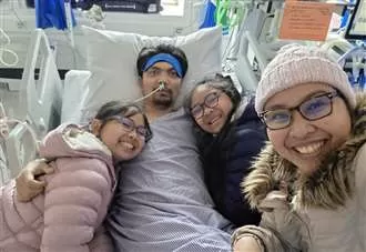 Dad remains in hospital three weeks after ‘rare complication’ following tonsil surgery